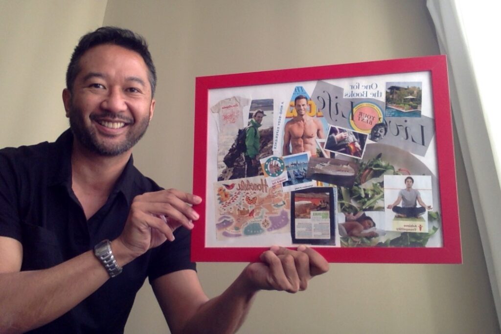 Picture of Joselito holding up a vision board